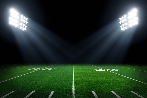 Football+field+at+night+with+stadium+lights.